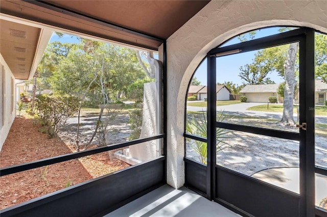 unfurnished sunroom with a healthy amount of sunlight