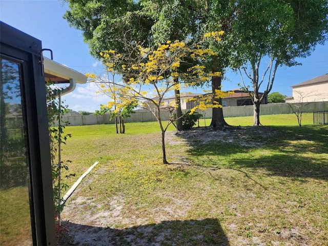 view of yard with a fenced backyard