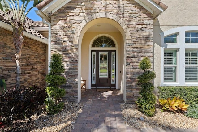 11502 Waterstone Loop Dr, Windermere, FL 34786 - property entrance with stone siding and stucco siding