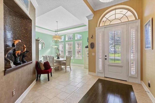 11502 Waterstone Loop Dr, Windermere, FL 34786 - entryway with a chandelier, baseboards, and crown molding
