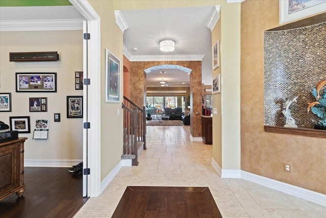 11502 Waterstone Loop Dr, Windermere, FL 34786 - hall with baseboards, crown molding, and arched walkways