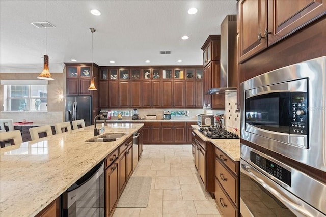 11502 Waterstone Loop Dr, Windermere, FL 34786 - kitchen with appliances with stainless steel finishes, a sink, hanging light fixtures, tasteful backsplash, and recessed lighting