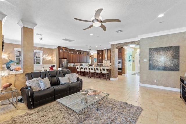 11502 Waterstone Loop Dr, Windermere, FL 34786 - living area with arched walkways, ceiling fan, crown molding, recessed lighting, and baseboards