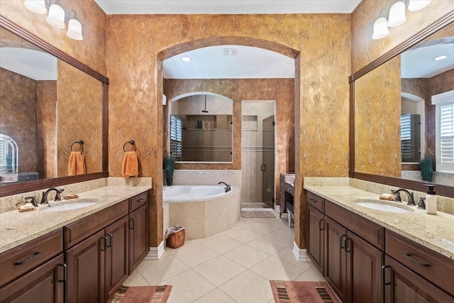11502 Waterstone Loop Dr, Windermere, FL 34786 - full bath with a shower stall, a garden tub, two vanities, and tile patterned flooring