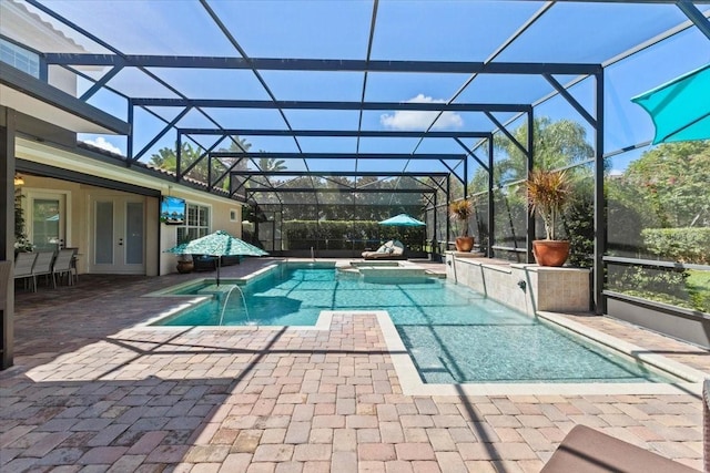 11502 Waterstone Loop Dr, Windermere, FL 34786 - view of swimming pool featuring a pool with connected hot tub, a patio area, glass enclosure, and french doors