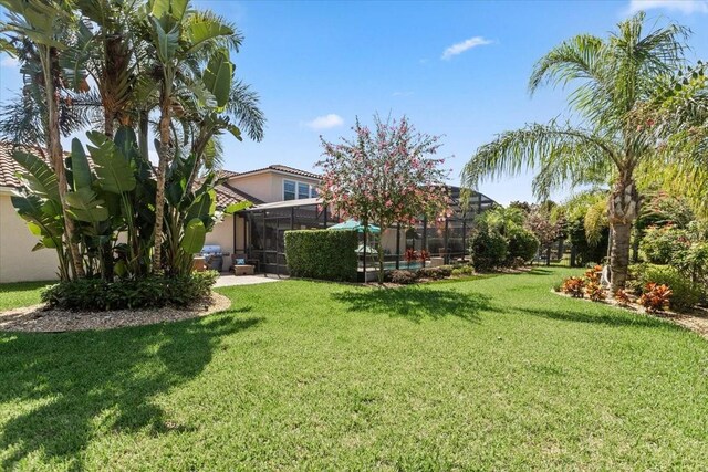 11502 Waterstone Loop Dr, Windermere, FL 34786 - view of grassy yard featuring a lanai