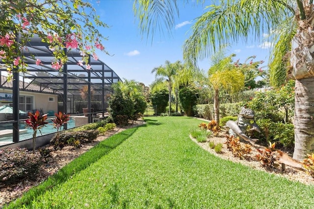 11502 Waterstone Loop Dr, Windermere, FL 34786 - view of green lawn with an outdoor pool and glass enclosure