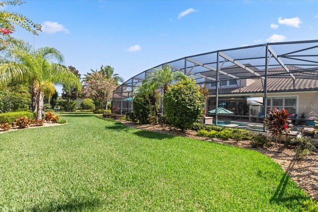 11502 Waterstone Loop Dr, Windermere, FL 34786 - view of green lawn featuring an outdoor pool and a lanai