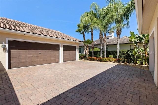 11502 Waterstone Loop Dr, Windermere, FL 34786 - garage with decorative driveway