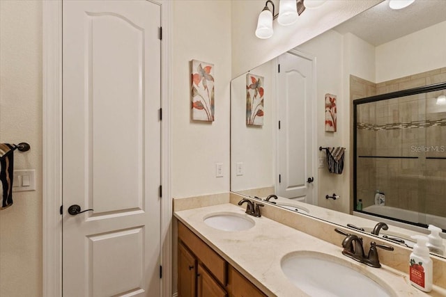 11502 Waterstone Loop Dr, Windermere, FL 34786 - bathroom with double vanity and shower / bath combination with glass door