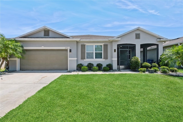 2952 Boating Blvd, Kissimmee, FL 34746 - single story home with stucco siding, an attached garage, driveway, and a front yard