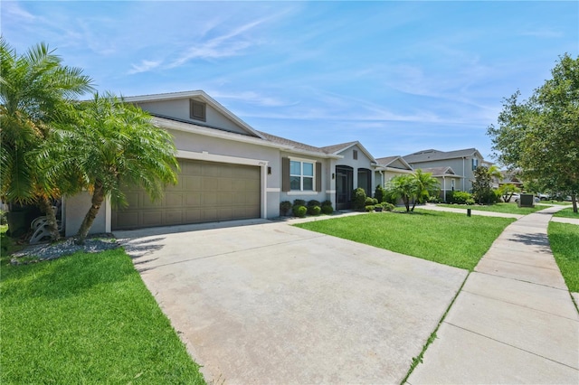2952 Boating Blvd, Kissimmee, FL 34746 - ranch-style home featuring a garage, stucco siding, driveway, and a front lawn