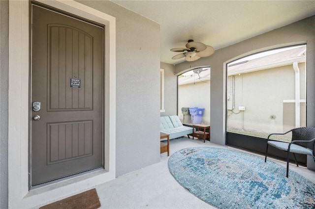 2952 Boating Blvd, Kissimmee, FL 34746 - view of exterior entry featuring a ceiling fan and stucco siding