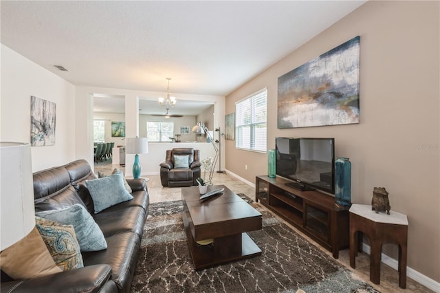 2952 Boating Blvd, Kissimmee, FL 34746 - living area with baseboards, an inviting chandelier, and visible vents