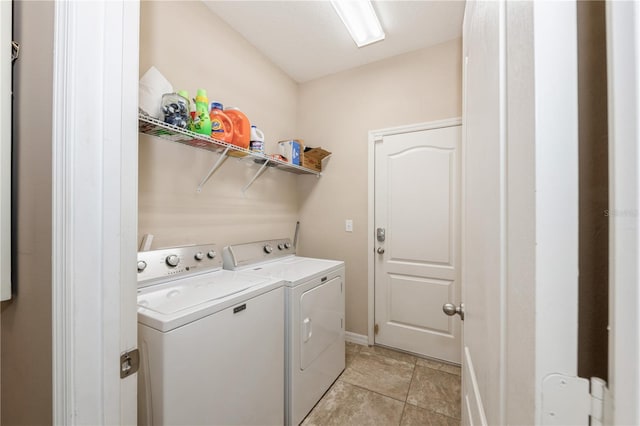 2952 Boating Blvd, Kissimmee, FL 34746 - washroom with baseboards, separate washer and dryer, laundry area, and light tile patterned flooring
