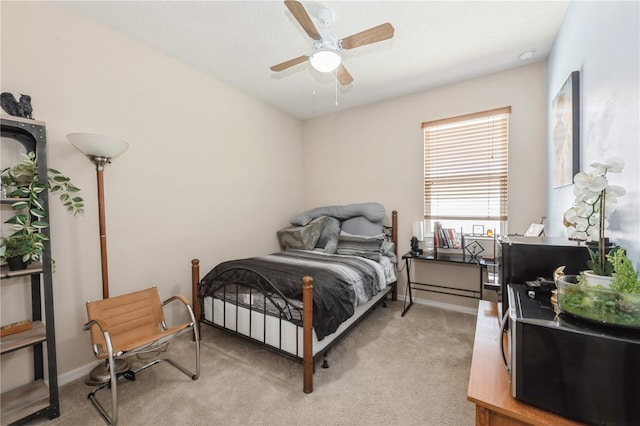 2952 Boating Blvd, Kissimmee, FL 34746 - bedroom with baseboards, a ceiling fan, and light carpet