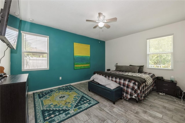2952 Boating Blvd, Kissimmee, FL 34746 - bedroom featuring a ceiling fan, baseboards, and wood finished floors