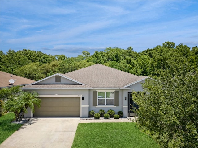 2952 Boating Blvd, Kissimmee, FL 34746 - ranch-style house featuring a garage, a shingled roof, driveway, and stucco siding