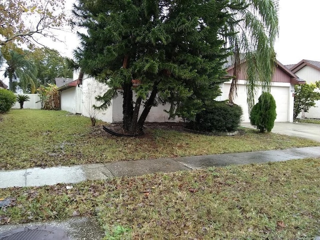 2011 N 61st St, Tampa, FL 33619 - view of home's exterior with driveway and a garage