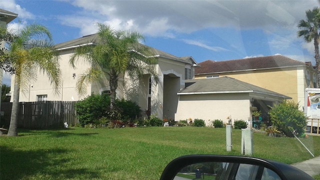 2011 N 61st St, Tampa, FL 33619 - view of side of property with stucco siding