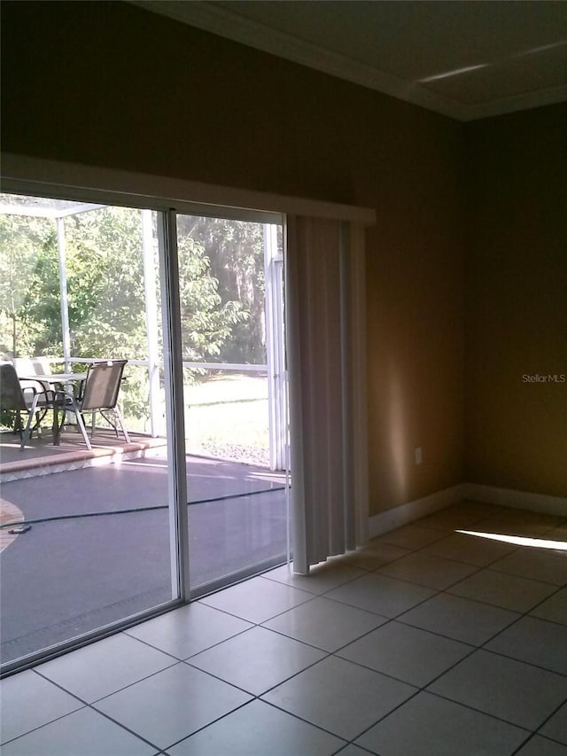 2011 N 61st St, Tampa, FL 33619 - spare room featuring light tile patterned floors and baseboards