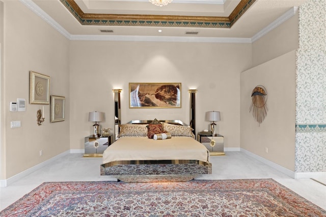 bedroom featuring a tray ceiling, ornamental molding, carpet flooring, and visible vents