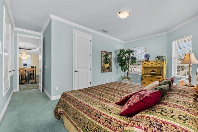 carpeted bedroom with crown molding, baseboards, a chandelier, and visible vents