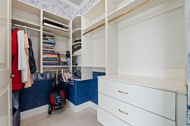 walk in closet with tile patterned floors