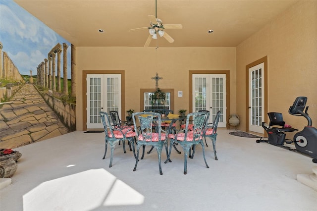 view of patio / terrace featuring ceiling fan, french doors, and outdoor dining area