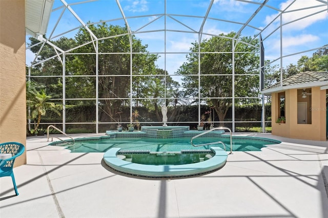 view of pool with a patio, a pool with connected hot tub, and a lanai