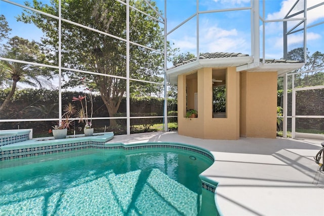 outdoor pool with a lanai and a patio