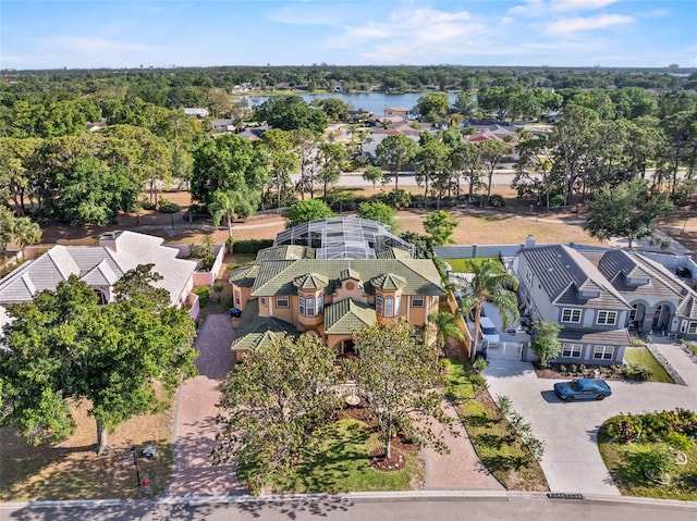 birds eye view of property featuring a water view and a residential view