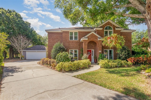 view of front of home with a garage, a front lawn, and brick siding