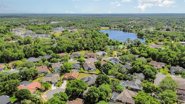 birds eye view of property featuring a water view and a residential view