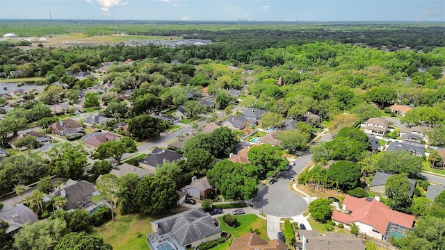 bird's eye view featuring a residential view and a view of trees