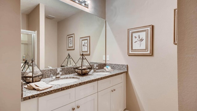 bathroom with double vanity and a sink