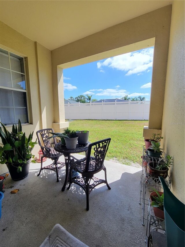 view of patio featuring fence