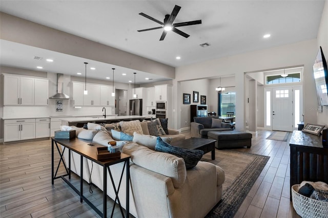 3332 Lone Cypress Pt, Oviedo, FL 32765 - living area with a ceiling fan, wood finished floors, recessed lighting, and baseboards