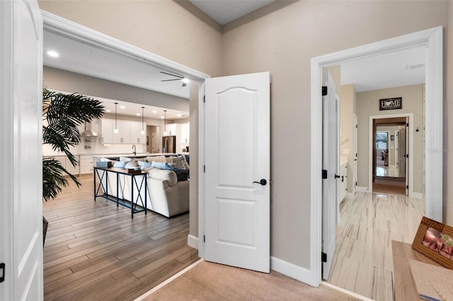 3332 Lone Cypress Pt, Oviedo, FL 32765 - hall featuring light wood-style flooring, baseboards, and recessed lighting