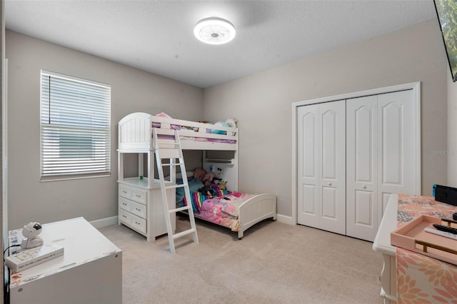 3332 Lone Cypress Pt, Oviedo, FL 32765 - bedroom featuring light carpet, a closet, and baseboards