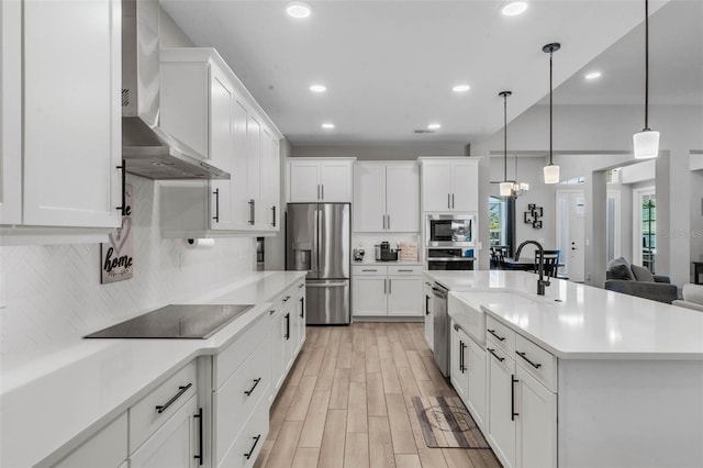 3332 Lone Cypress Pt, Oviedo, FL 32765 - kitchen with stainless steel appliances, wall chimney exhaust hood, backsplash, light countertops, and white cabinets