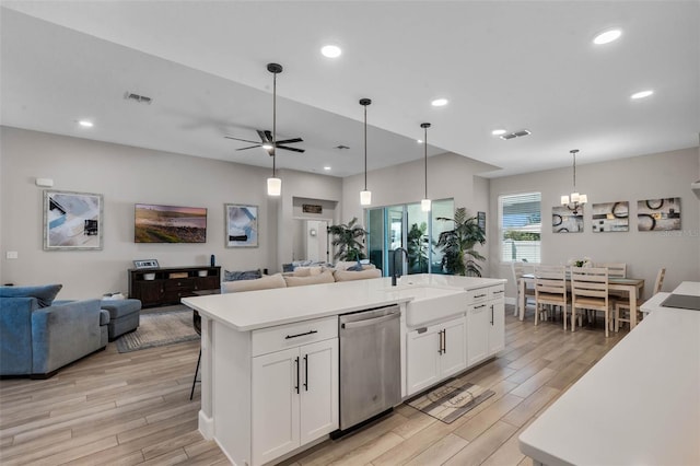 3332 Lone Cypress Pt, Oviedo, FL 32765 - kitchen featuring a sink, open floor plan, stainless steel dishwasher, light wood-style flooring, and recessed lighting