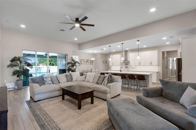 3332 Lone Cypress Pt, Oviedo, FL 32765 - living area with a ceiling fan, light wood-style flooring, and recessed lighting