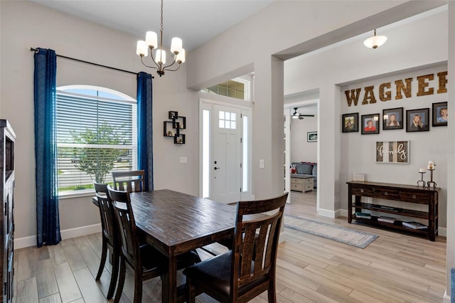 3332 Lone Cypress Pt, Oviedo, FL 32765 - dining space with light wood-style floors, plenty of natural light, and a chandelier