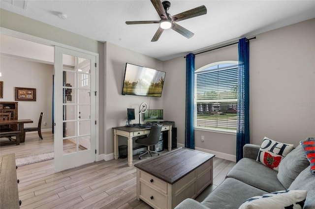 3332 Lone Cypress Pt, Oviedo, FL 32765 - living room featuring a desk, ceiling fan, light wood-type flooring, and baseboards
