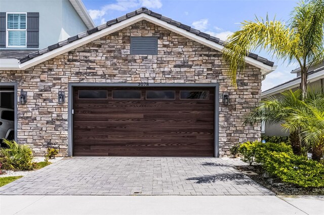 3078 Isles Way, New Smyrna Beach, FL 32168 - garage featuring decorative driveway