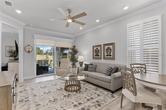 3078 Isles Way, New Smyrna Beach, FL 32168 - living area with a ceiling fan, light wood-type flooring, recessed lighting, and ornamental molding