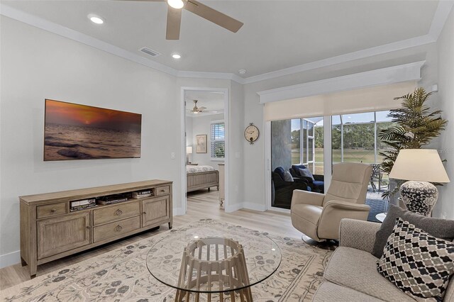 3078 Isles Way, New Smyrna Beach, FL 32168 - living room featuring a ceiling fan, light wood-type flooring, plenty of natural light, crown molding, and recessed lighting