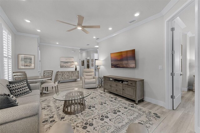 3078 Isles Way, New Smyrna Beach, FL 32168 - living room with ceiling fan, light wood-style flooring, crown molding, baseboards, and recessed lighting