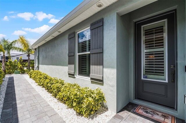 3078 Isles Way, New Smyrna Beach, FL 32168 - entrance to property featuring stucco siding